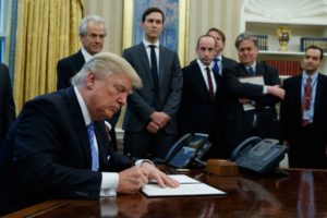 trump signing executive order oval office men wealth in politics white house