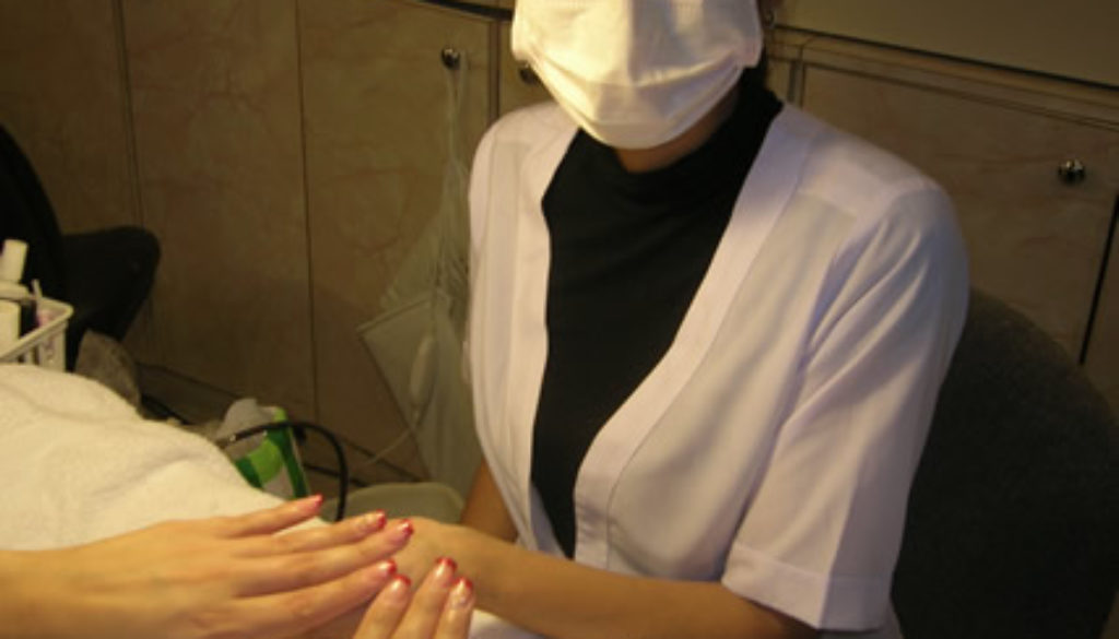 nails salon worker manicure health safety mask